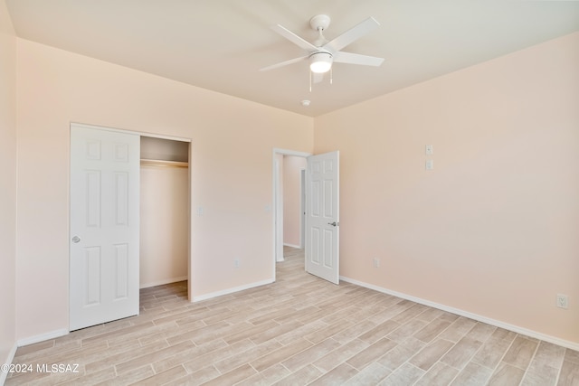 unfurnished bedroom with a closet, light hardwood / wood-style floors, and ceiling fan