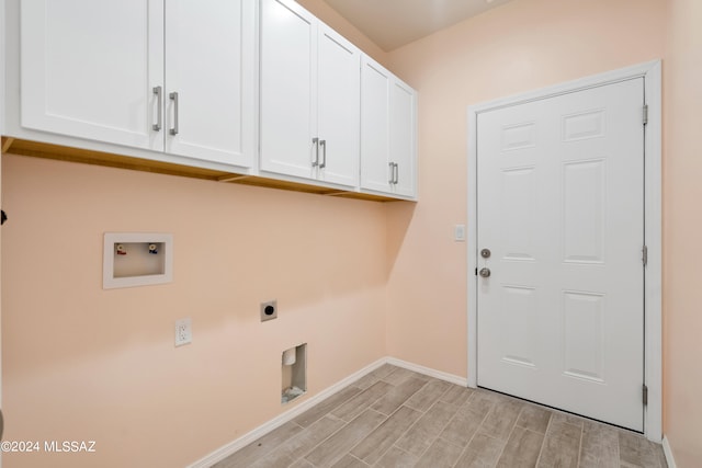 laundry room featuring cabinets, hookup for an electric dryer, washer hookup, and light wood-type flooring