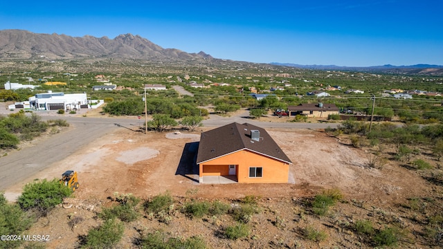 birds eye view of property featuring a mountain view