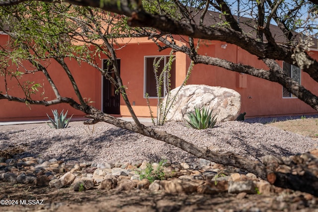 view of side of property featuring a patio area