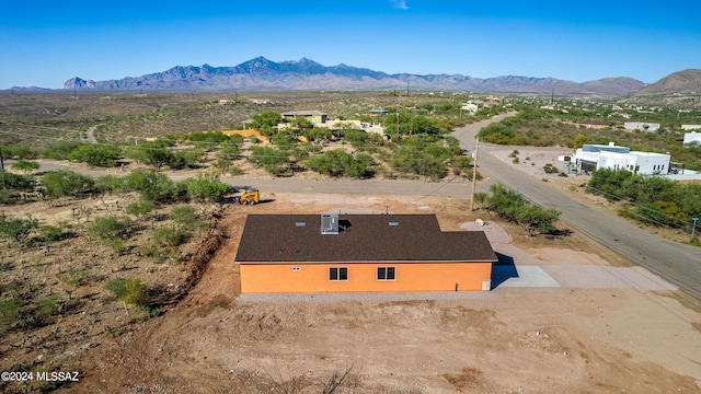 drone / aerial view featuring a mountain view