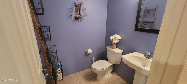 bathroom featuring tile patterned flooring and toilet