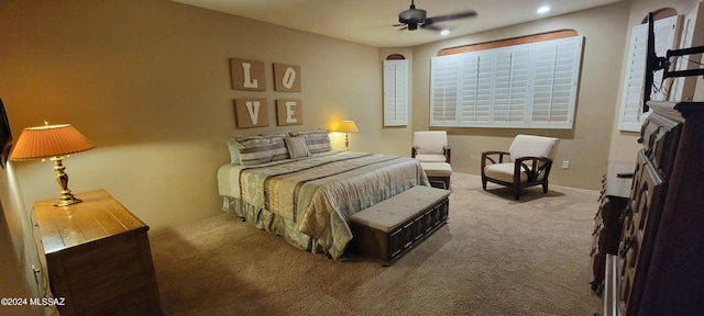 bedroom featuring ceiling fan and carpet floors