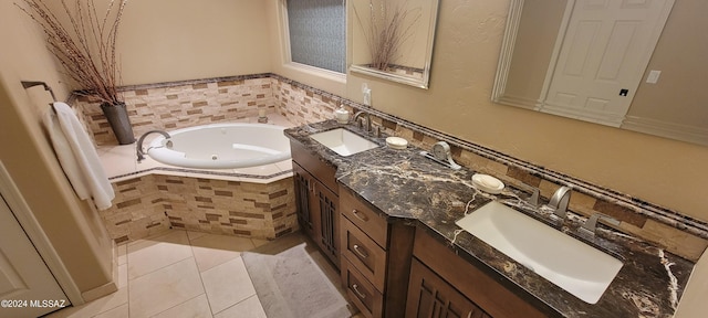 bathroom with tiled bath, tile patterned flooring, and vanity