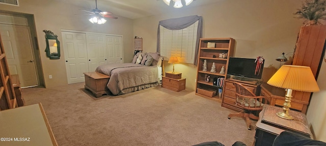 carpeted bedroom featuring a closet and ceiling fan