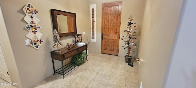 doorway featuring light tile patterned floors