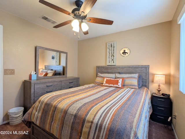 bedroom featuring dark colored carpet and ceiling fan