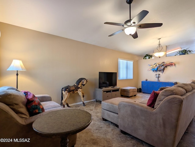 living room featuring vaulted ceiling, tile patterned floors, and ceiling fan