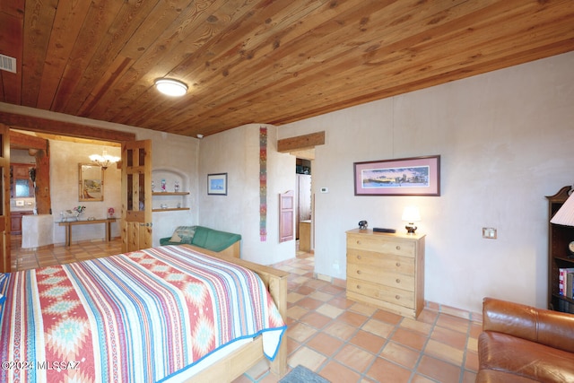 bedroom with wood ceiling, an inviting chandelier, and light tile patterned floors