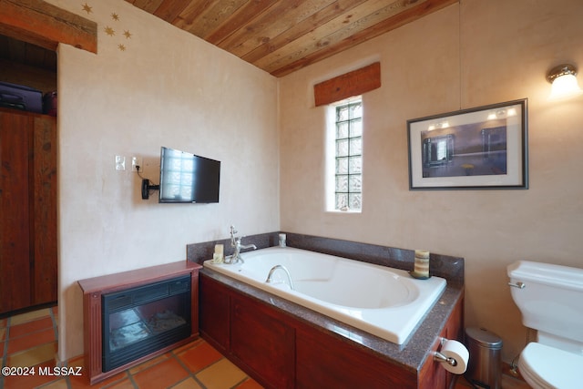 bathroom featuring a tub to relax in, tile patterned flooring, toilet, and wood ceiling