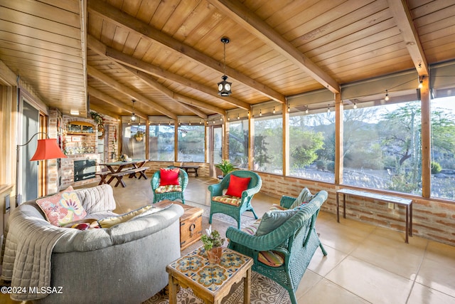 sunroom featuring wood ceiling, lofted ceiling with beams, and a wealth of natural light