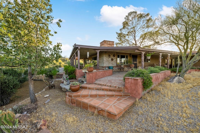 rear view of house featuring a patio