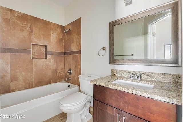 full bathroom featuring vanity, tiled shower / bath combo, toilet, and tile patterned floors