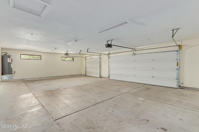 garage featuring a garage door opener and electric water heater