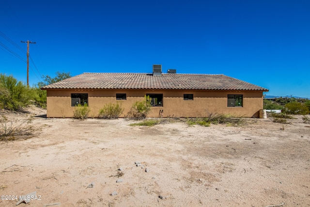 back of property with cooling unit