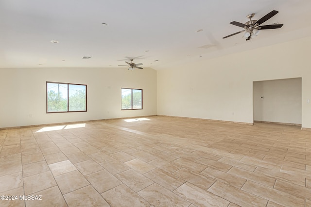 unfurnished room featuring lofted ceiling and ceiling fan