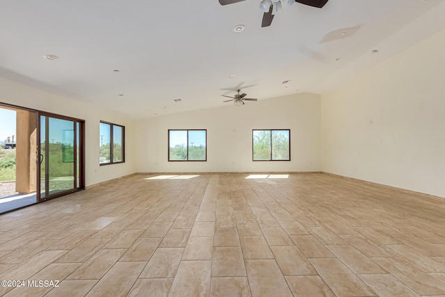 empty room featuring light hardwood / wood-style flooring, ceiling fan, and lofted ceiling