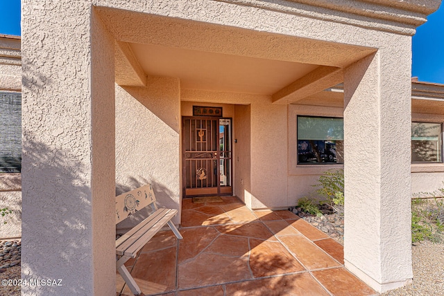 entrance to property with a patio