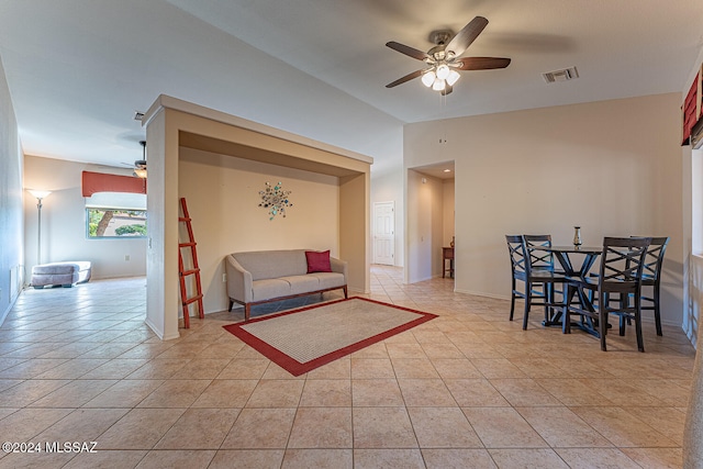 tiled living room with ceiling fan