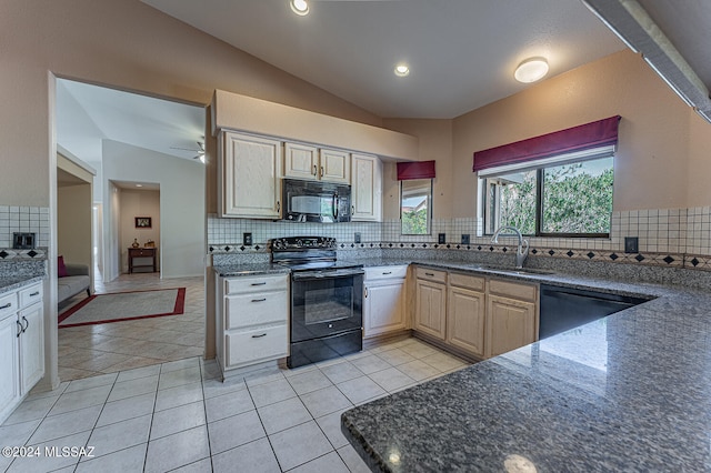 kitchen featuring sink, tasteful backsplash, vaulted ceiling, light tile patterned flooring, and black appliances