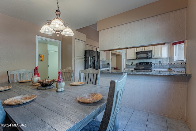 unfurnished dining area featuring light tile patterned floors and a chandelier