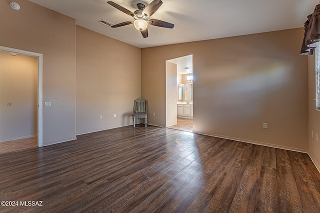 unfurnished room with dark hardwood / wood-style floors, ceiling fan, and lofted ceiling