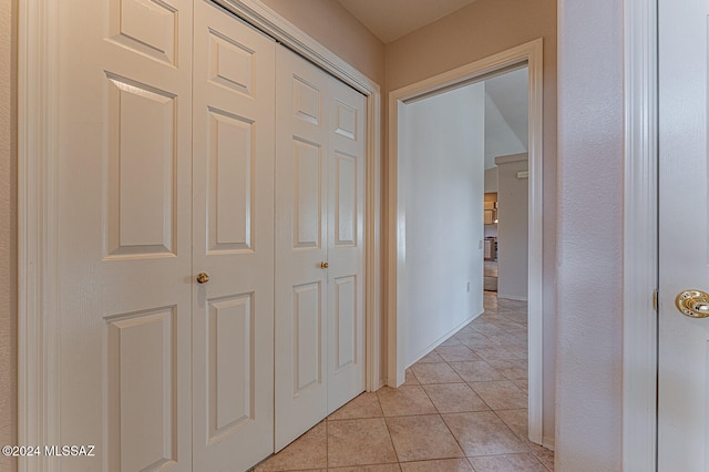 hallway featuring light tile patterned flooring