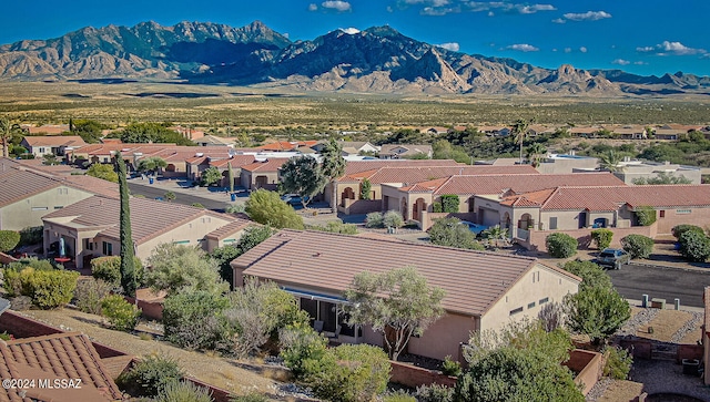 birds eye view of property with a mountain view