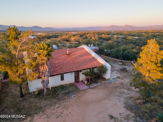 aerial view at dusk with a mountain view