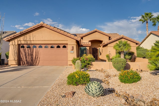 view of front of home with a garage