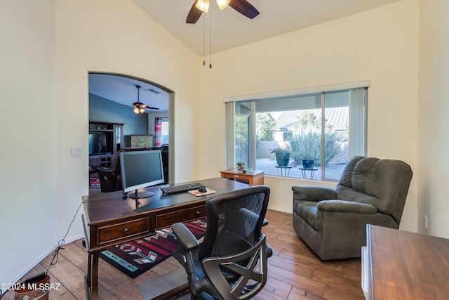 home office with ceiling fan, lofted ceiling, and hardwood / wood-style flooring