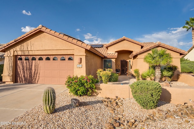 view of front of property with a garage