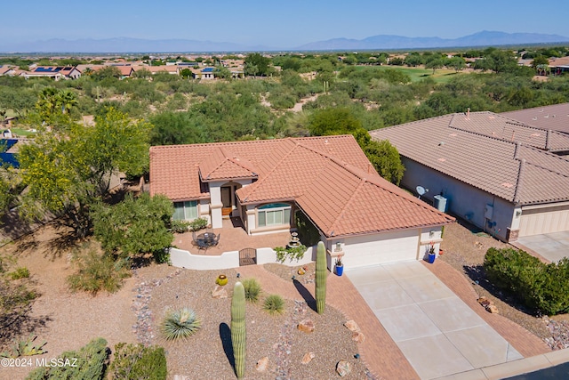 birds eye view of property featuring a mountain view