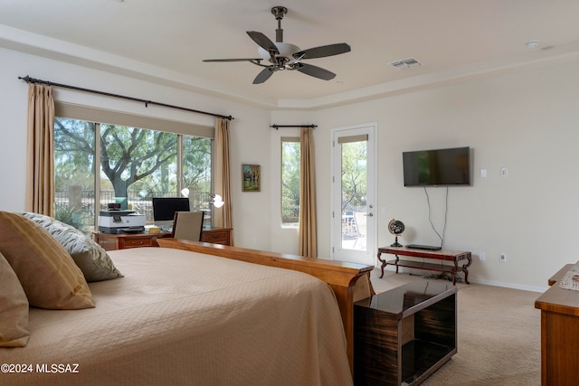 bedroom with ceiling fan, light colored carpet, and access to exterior