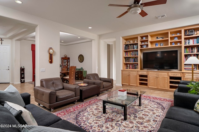 living room with ceiling fan and light tile patterned floors