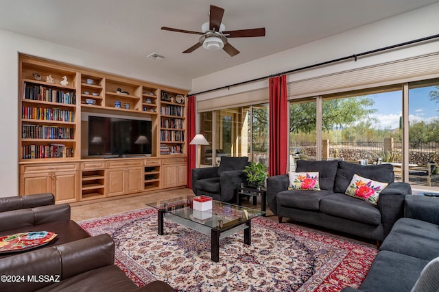 tiled living room featuring ceiling fan