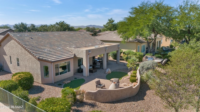 back of property with a patio area