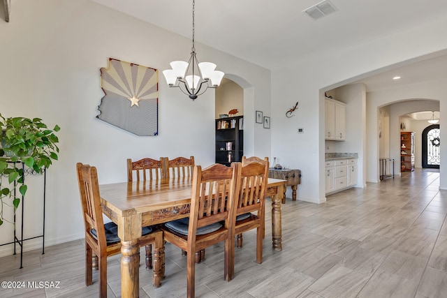 dining room with a notable chandelier