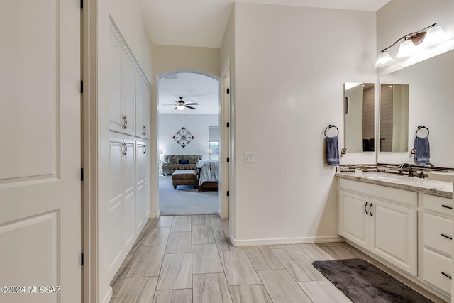 bathroom with vanity and ceiling fan