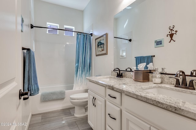 full bathroom featuring vanity, shower / bath combination with curtain, and toilet