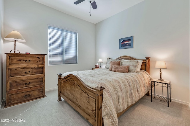 bedroom with light carpet and ceiling fan