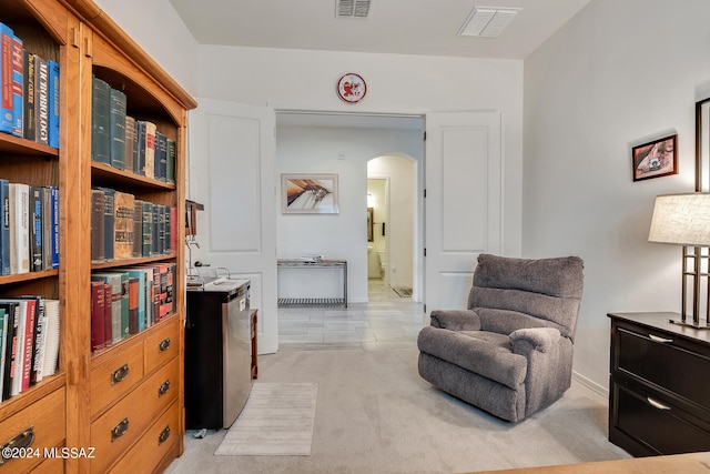 living area featuring light colored carpet