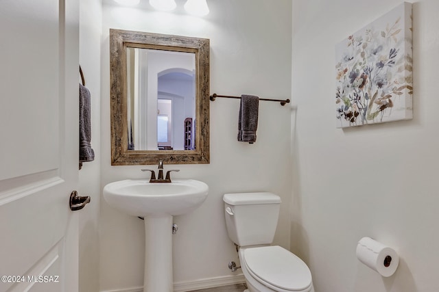 bathroom with sink and toilet