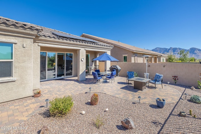 exterior space featuring a fire pit and a mountain view