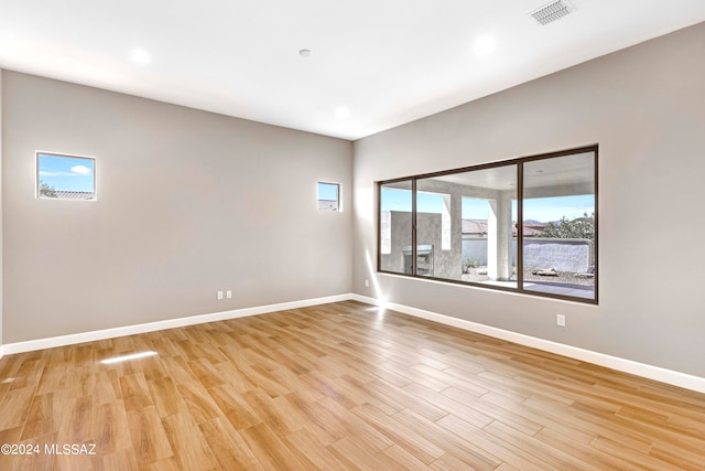 spare room with light hardwood / wood-style floors