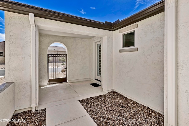 doorway to property with a patio area