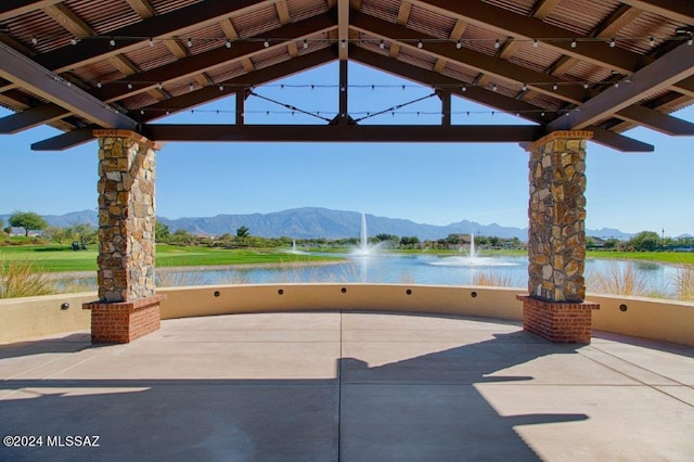 view of patio featuring a gazebo and a water and mountain view