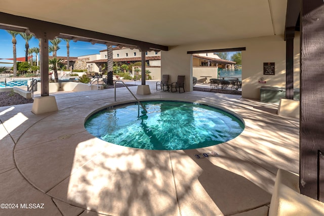 view of swimming pool featuring a patio