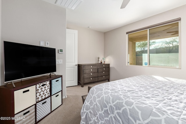 bedroom featuring light carpet and ceiling fan