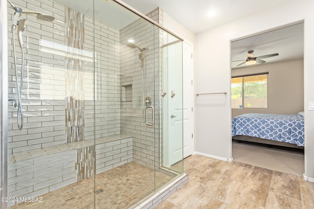 bathroom with ceiling fan and walk in shower